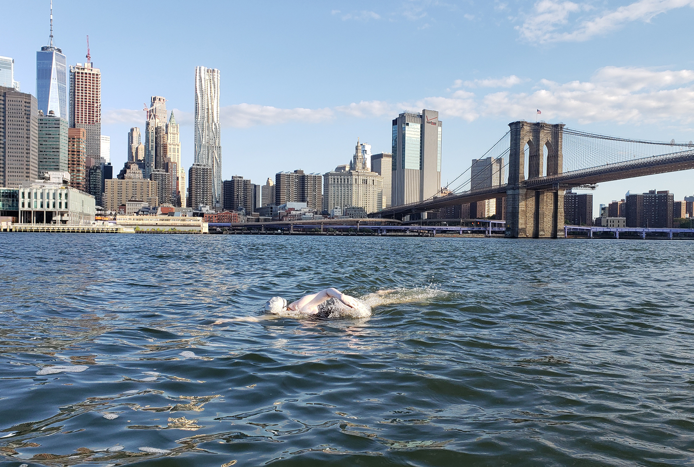 glorious jaimie monahan ice swimming in hudson river in front of new york sky line