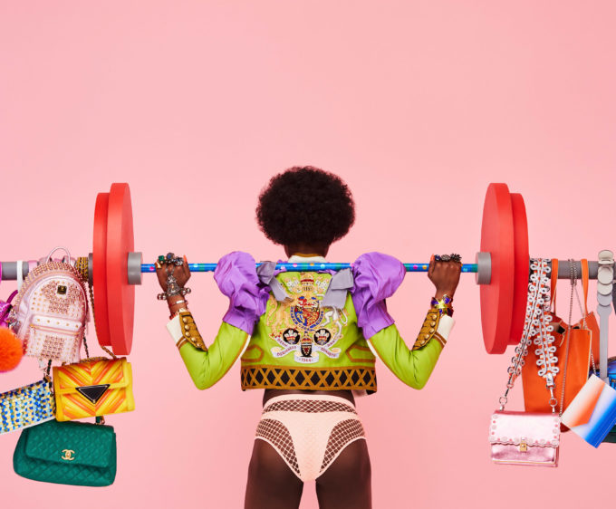 glorious aleksandra kingo lets get physical woman holding weights with bags