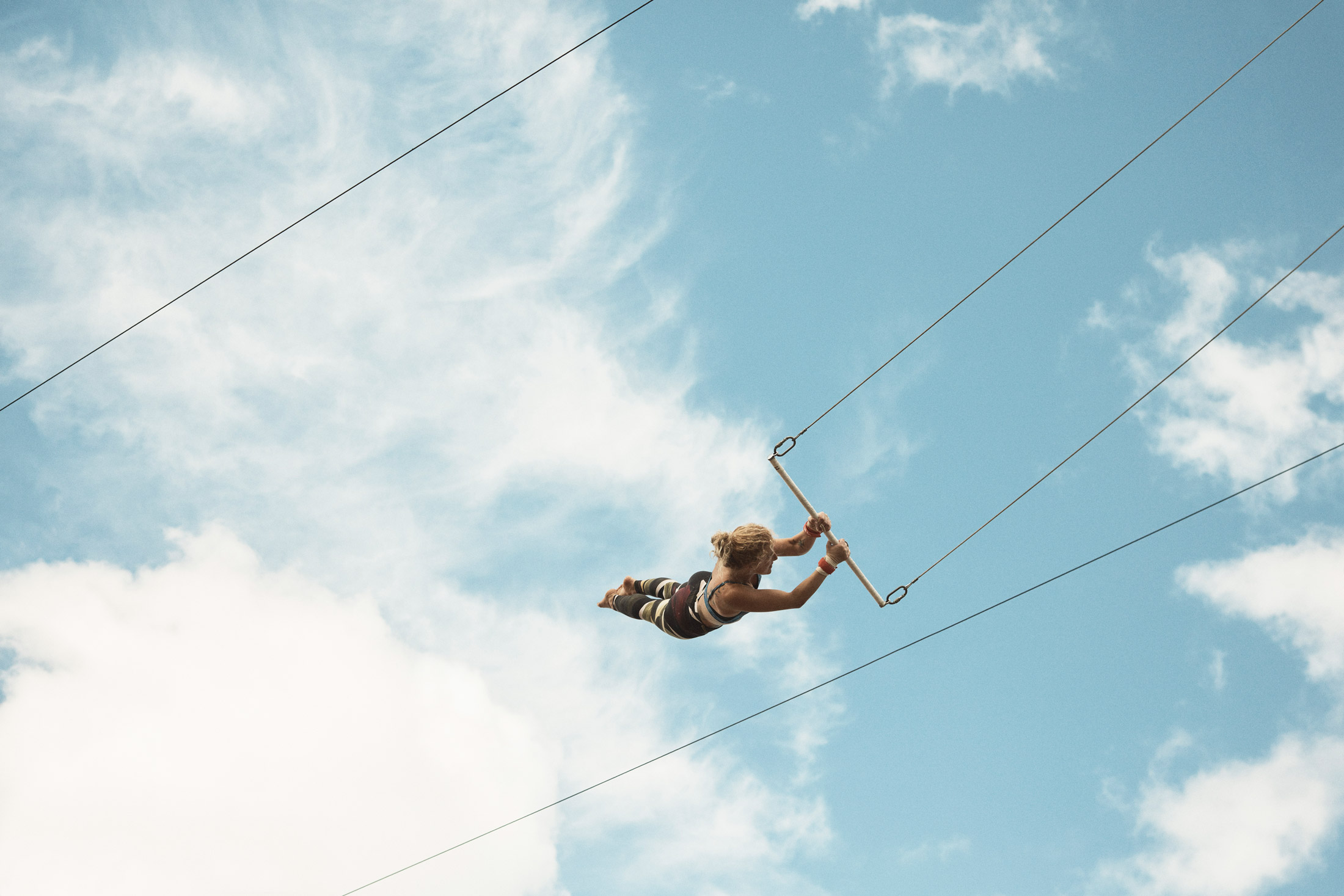 Woman swinging on trapeze