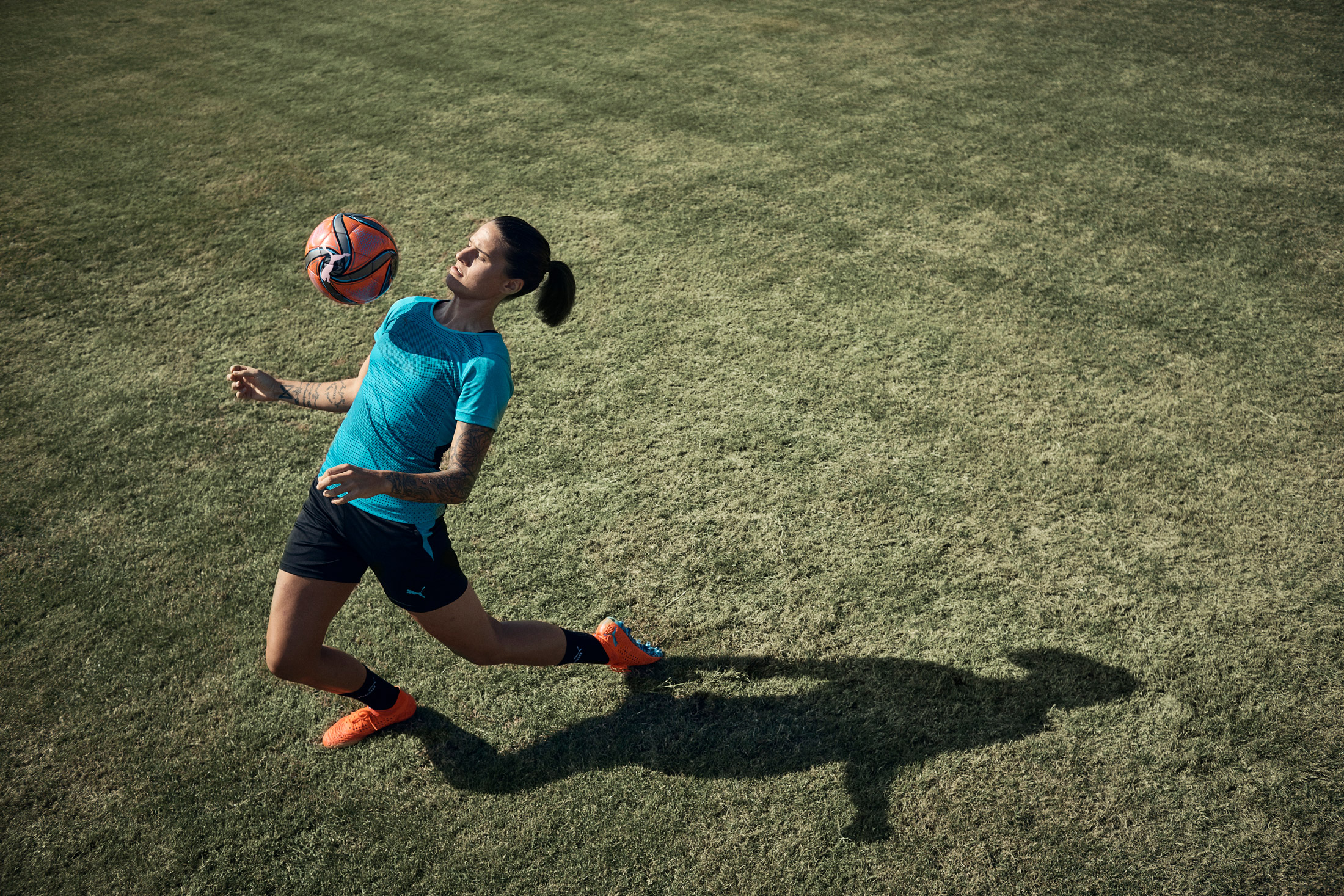 woman playing with football