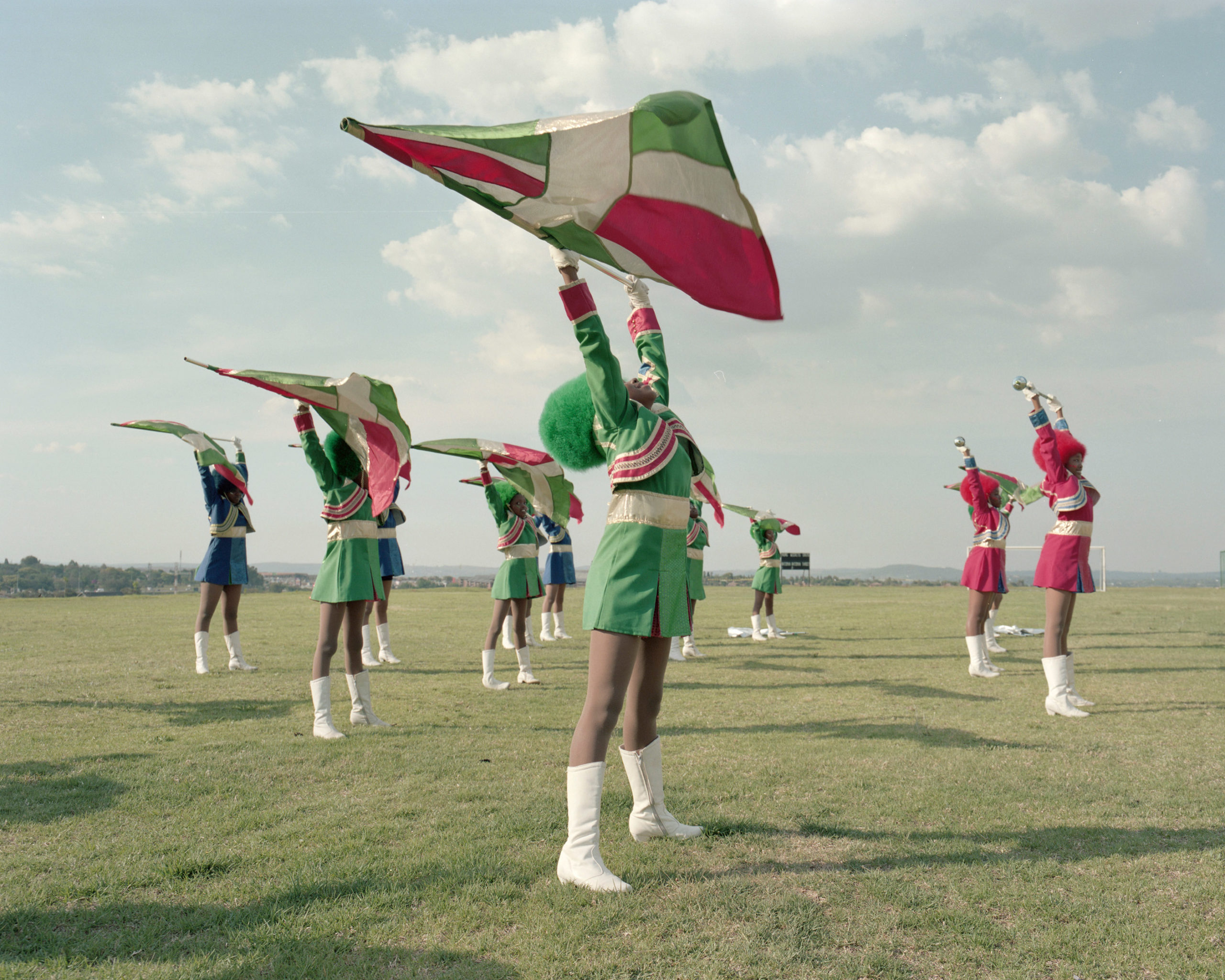 glorious alice mann drummies majorettes south africa waving flags in position